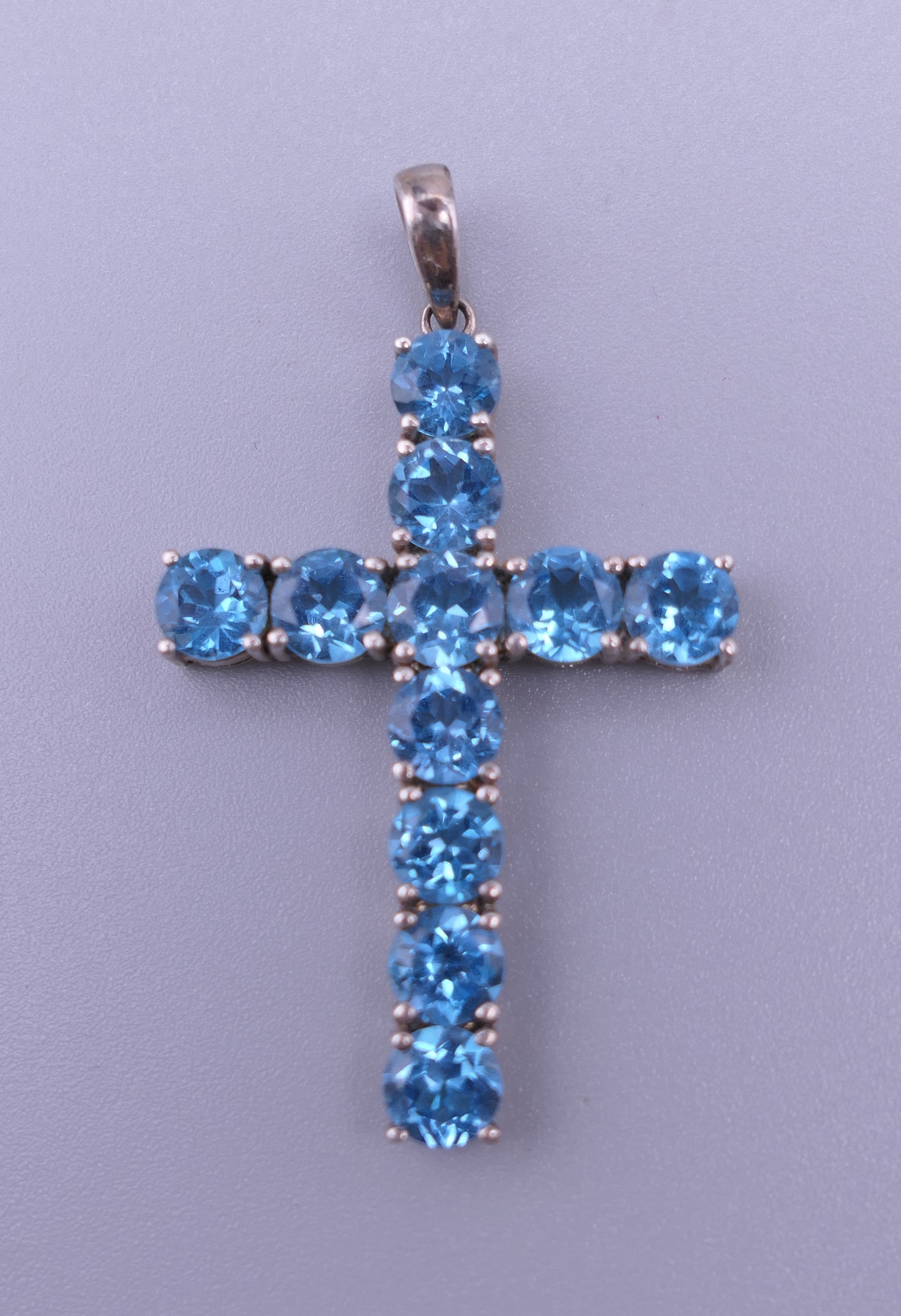 A sterling silver blue stone cross pendant, - Image 2 of 12