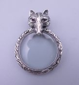 A silver pendant photograph locket formed as a fox. 4 cm high.