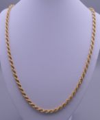 An 18 ct gold rope twist chain. 61 cm long. 18.4 grammes.