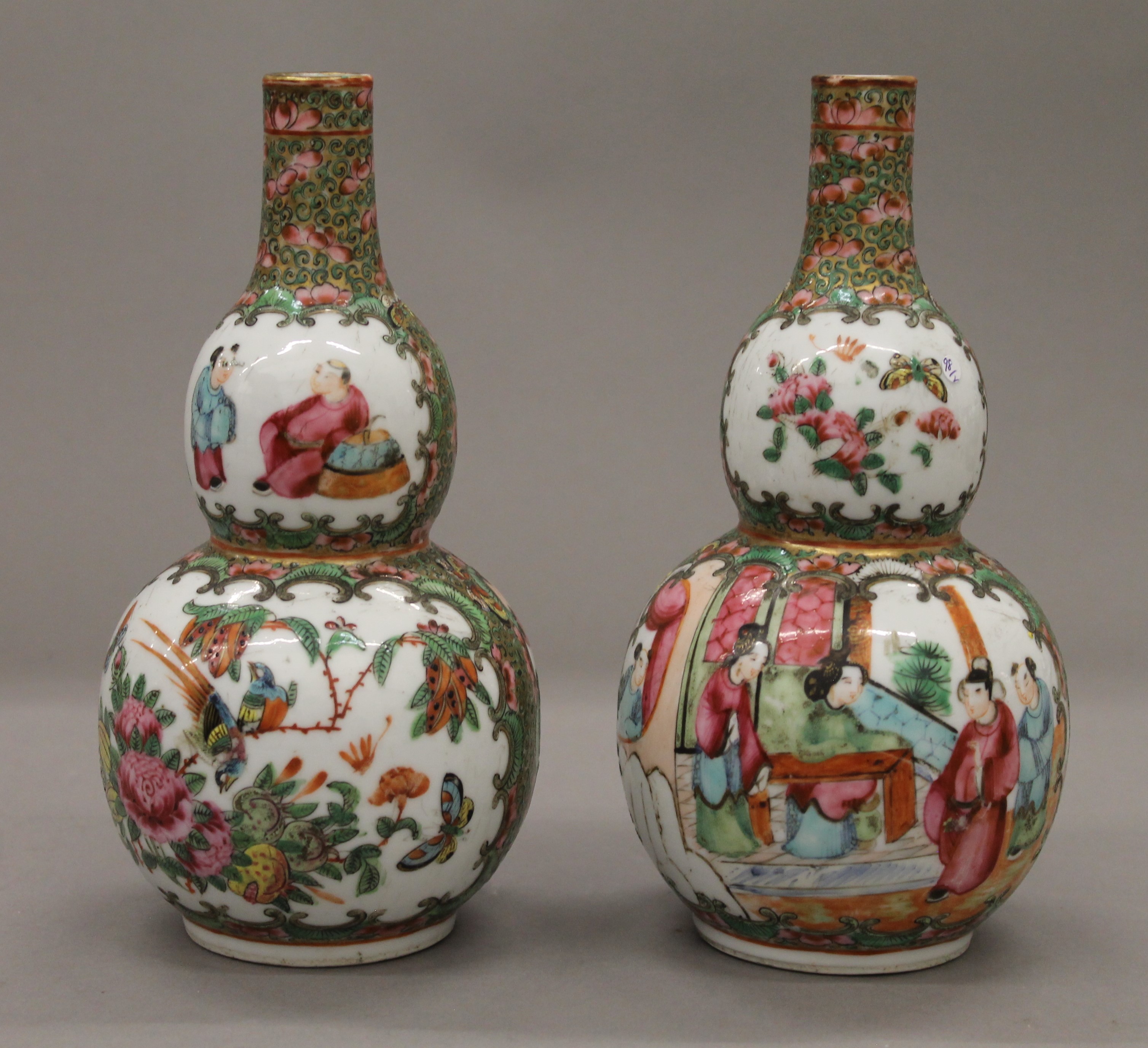 A pair of 19th century Canton double gourd vases. Each 19 cm high.