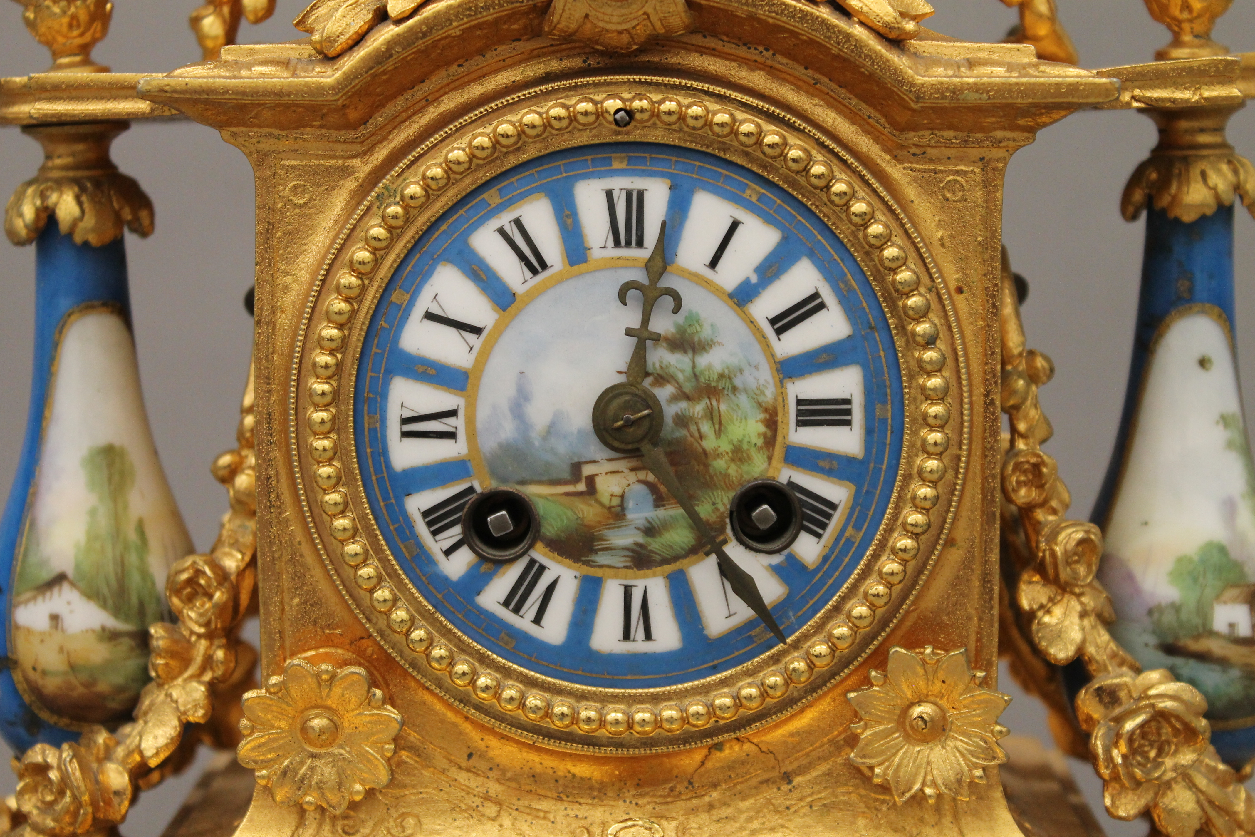 A 19th century gilt and painted porcelain three-piece clock garniture. The clock 37 cm high. - Image 3 of 11