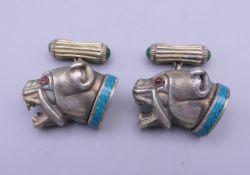 A pair of silver dog form cufflinks, bearing Russian marks. 2.5 cm wide.