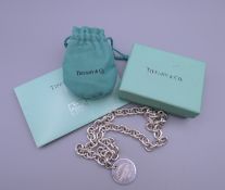 A boxed Tiffany and Co silver necklace. 42 cm long. 61.7 grammes.