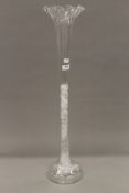 A large clear glass flute. 76 cm high.