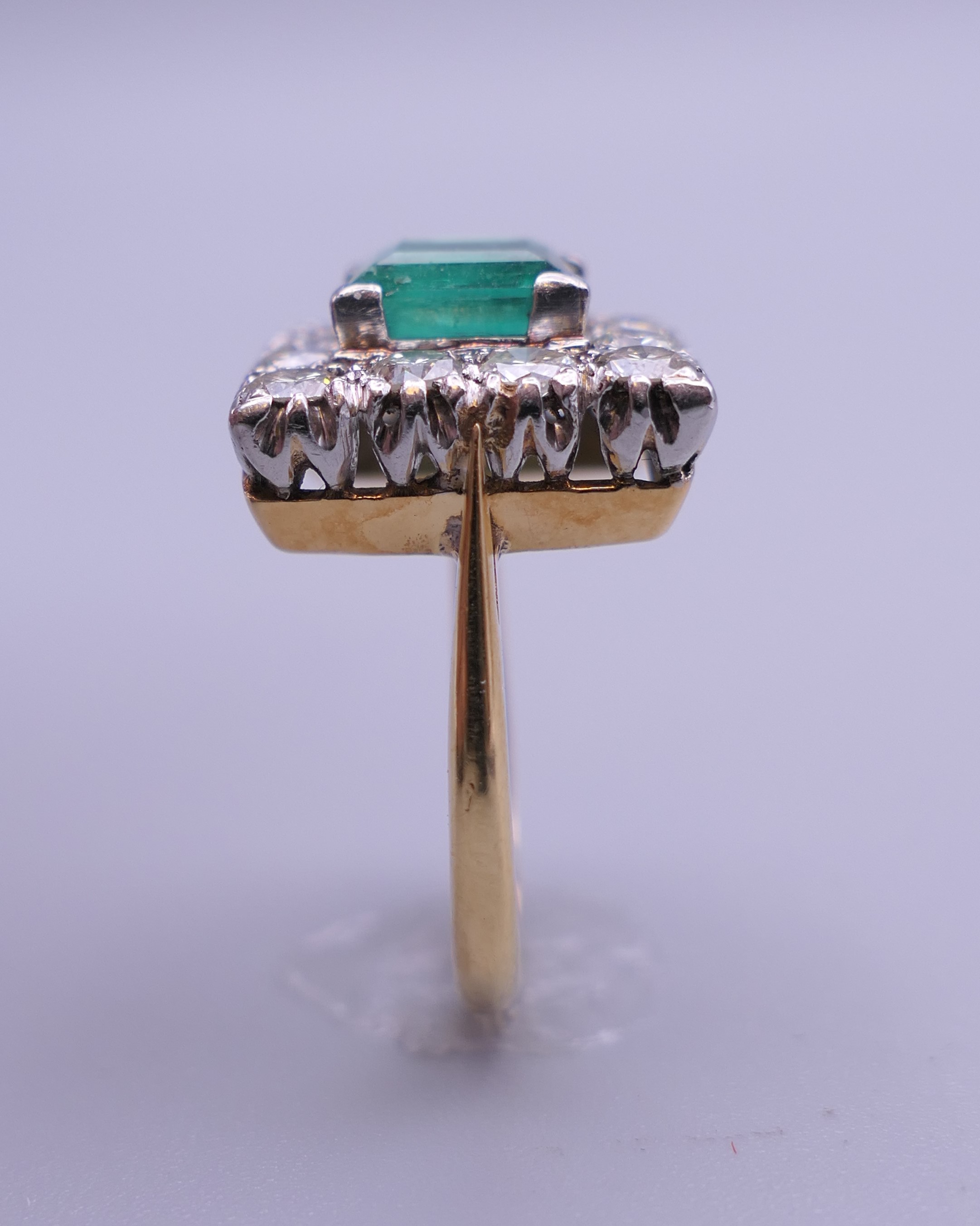 An 18 ct gold and platinum emerald and diamond ring. Ring size H/I (with previous sizing mounts). 1. - Image 3 of 8