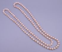 A string of pearls. 120 cm long.