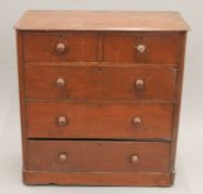 A Victorian brown painted chest of drawers. 97 cm wide.