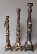 Three wooden pricket sticks. The largest 105 cm high.