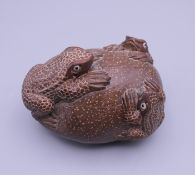 A Japanese carving of frogs. 9 cm long.