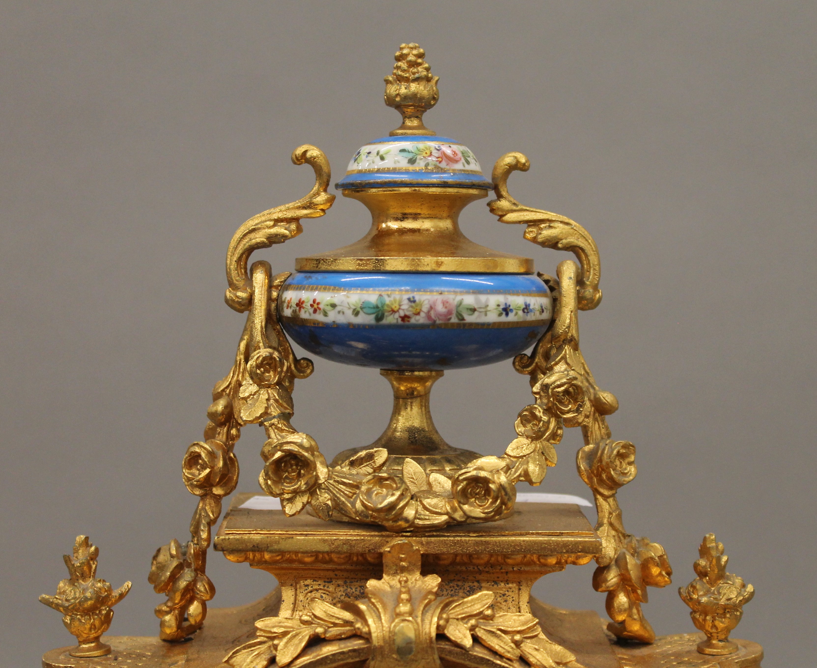 A 19th century gilt and painted porcelain three-piece clock garniture. The clock 37 cm high. - Image 6 of 11