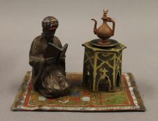 A cold painted bronze Arab inkwell. 14 cm long.