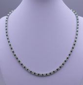 A 925 silver synthetic emerald necklace. 40 cm long.