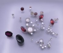 A collection of various gemstones, including diamonds, sapphires, etc.