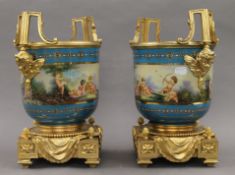 A pair of Sevres style cache pots. 33 cm high.