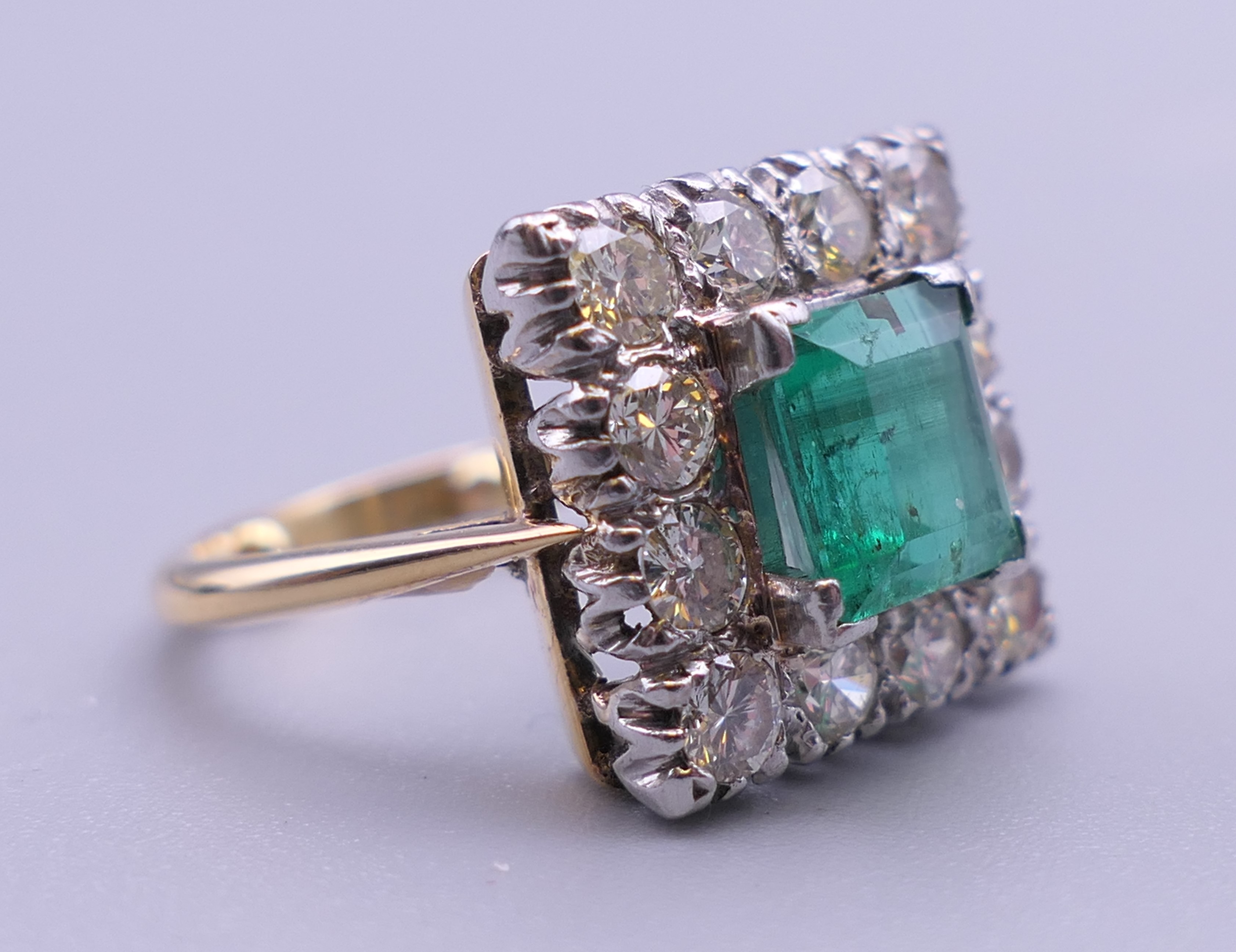 An 18 ct gold and platinum emerald and diamond ring. Ring size H/I (with previous sizing mounts). 1. - Image 8 of 8