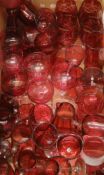 A large quantity of various cranberry glass