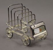 A silver plated toast rack formed as a car. 16 cm long.