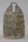 A Chinese archaic style bronze bell. 26 cm high.