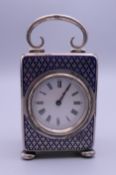 A silver enamel decorated miniature carriage clock. 9.5 cm high.