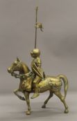 A brass model of a knight on horseback. 36.5 cm high.