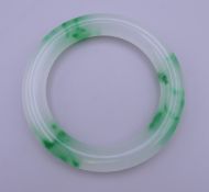 A white and green jade bangle. 8.5 cm diameter.