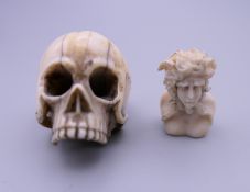 A 19th century ivory skull and a small bust. The former 3 cm high.