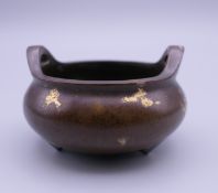 A small Chinese bronze gold splash censer. 5.5 cm wide.