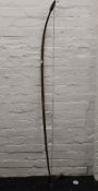 A vintage archery bow. 158 cm long.