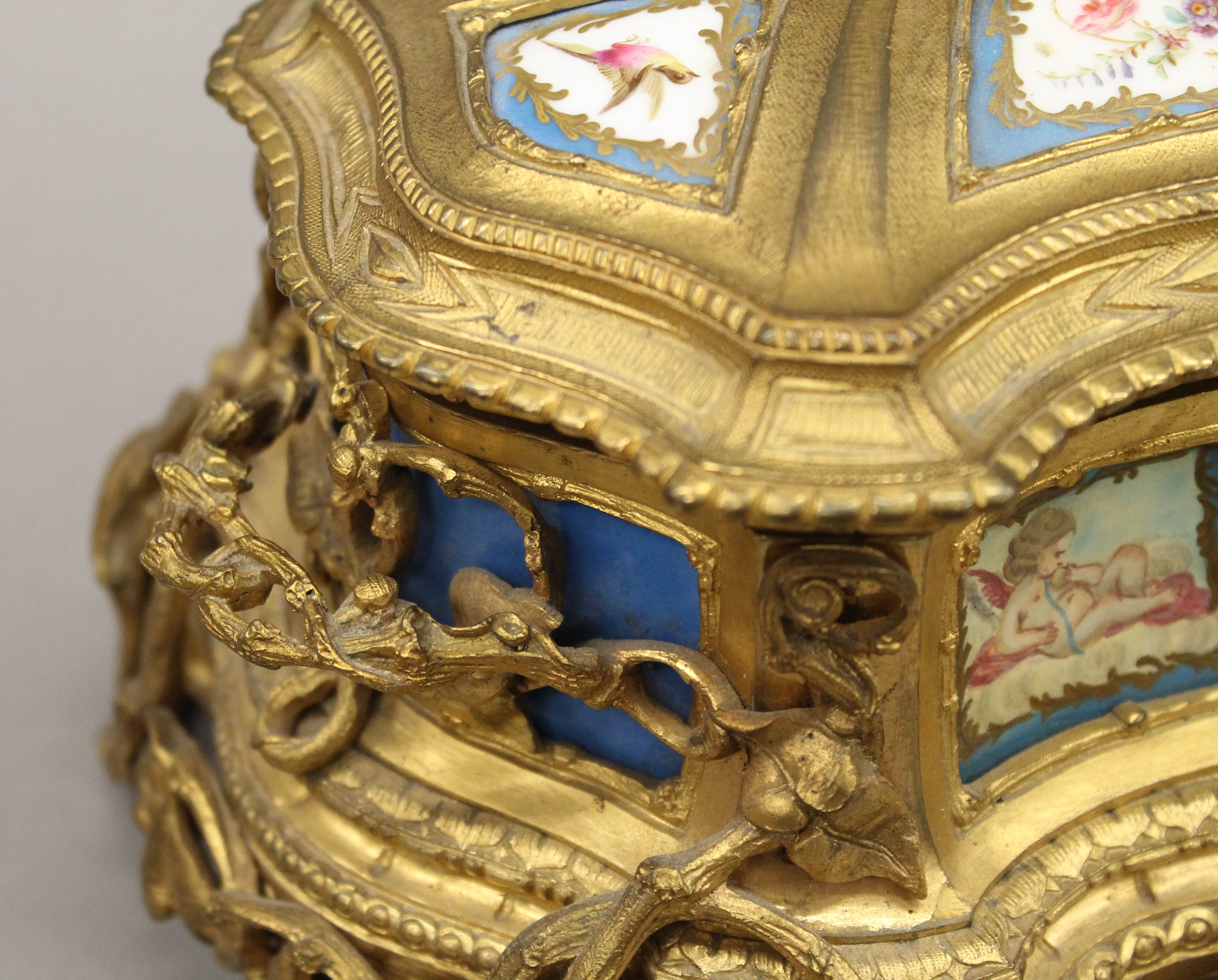 A 19th century Continental painted porcelain mounted ormolu casket. 25 cm wide. - Image 6 of 7