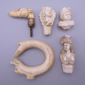 Five 19th century ivory cane handles. The largest 6.5 cm high.