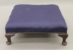 An early 20th century upholstered stool. 51 x 51 cm.