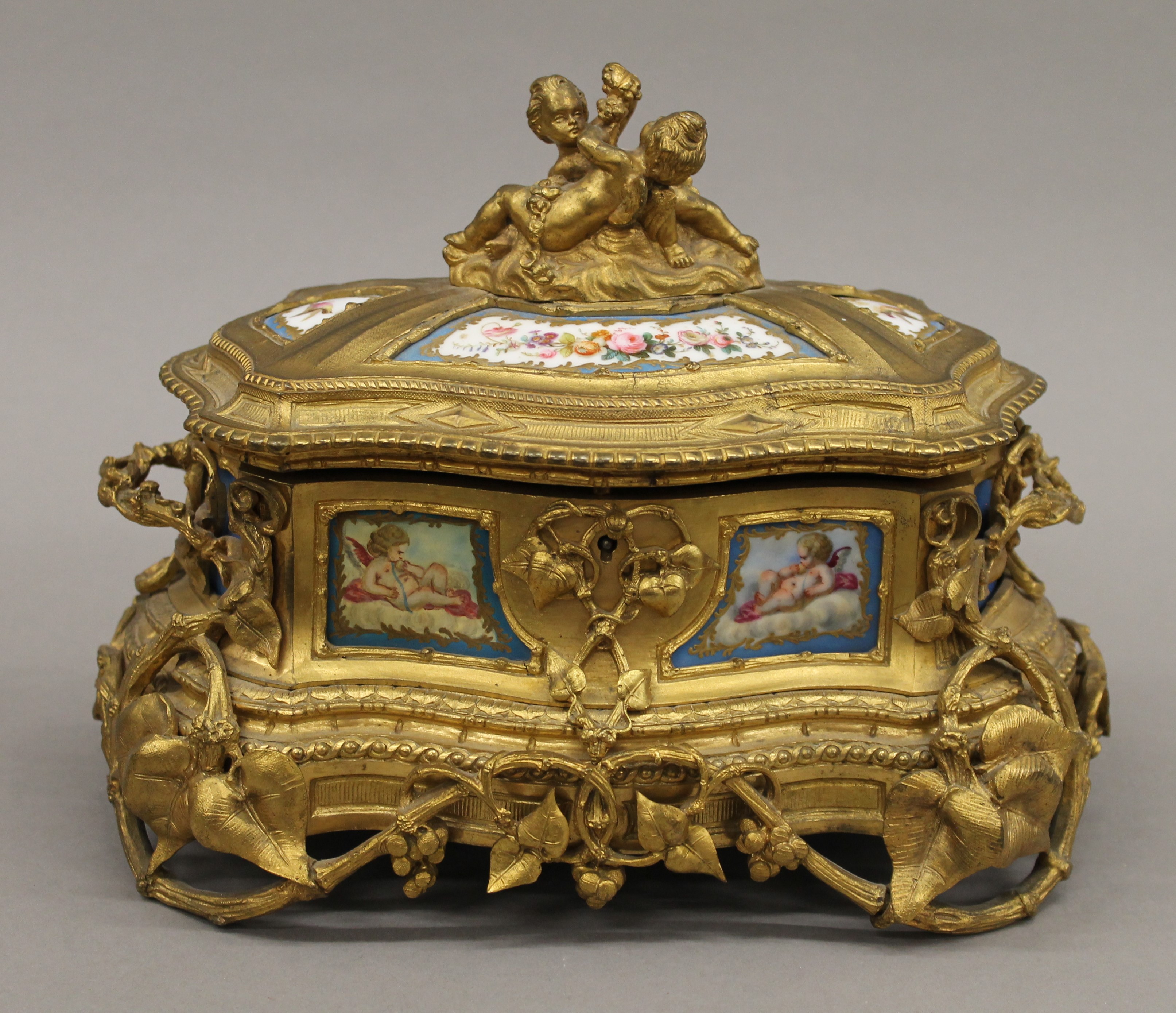 A 19th century Continental painted porcelain mounted ormolu casket. 25 cm wide.