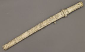 A 19th century Japanese carved bone mounted ceremonial sword. 60 cm long overall.