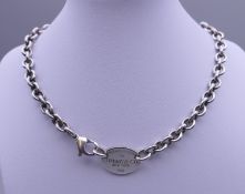 A Tiffany & Co silver 'Return to Tiffany' oval tag necklace. 39 cm long. 54.3 grammes.