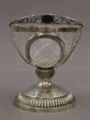 A silver basket with cut glass liner. 18 cm high overall.