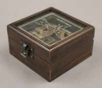 A boxed sundial compass. The box 9.5 cm square.