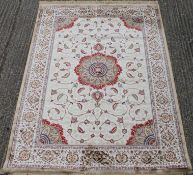 A gold ground full pile Kashmir floral medallion rug. 240 x 160 cm.