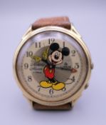 A Mickey Mouse wristwatch. 3 cm wide.