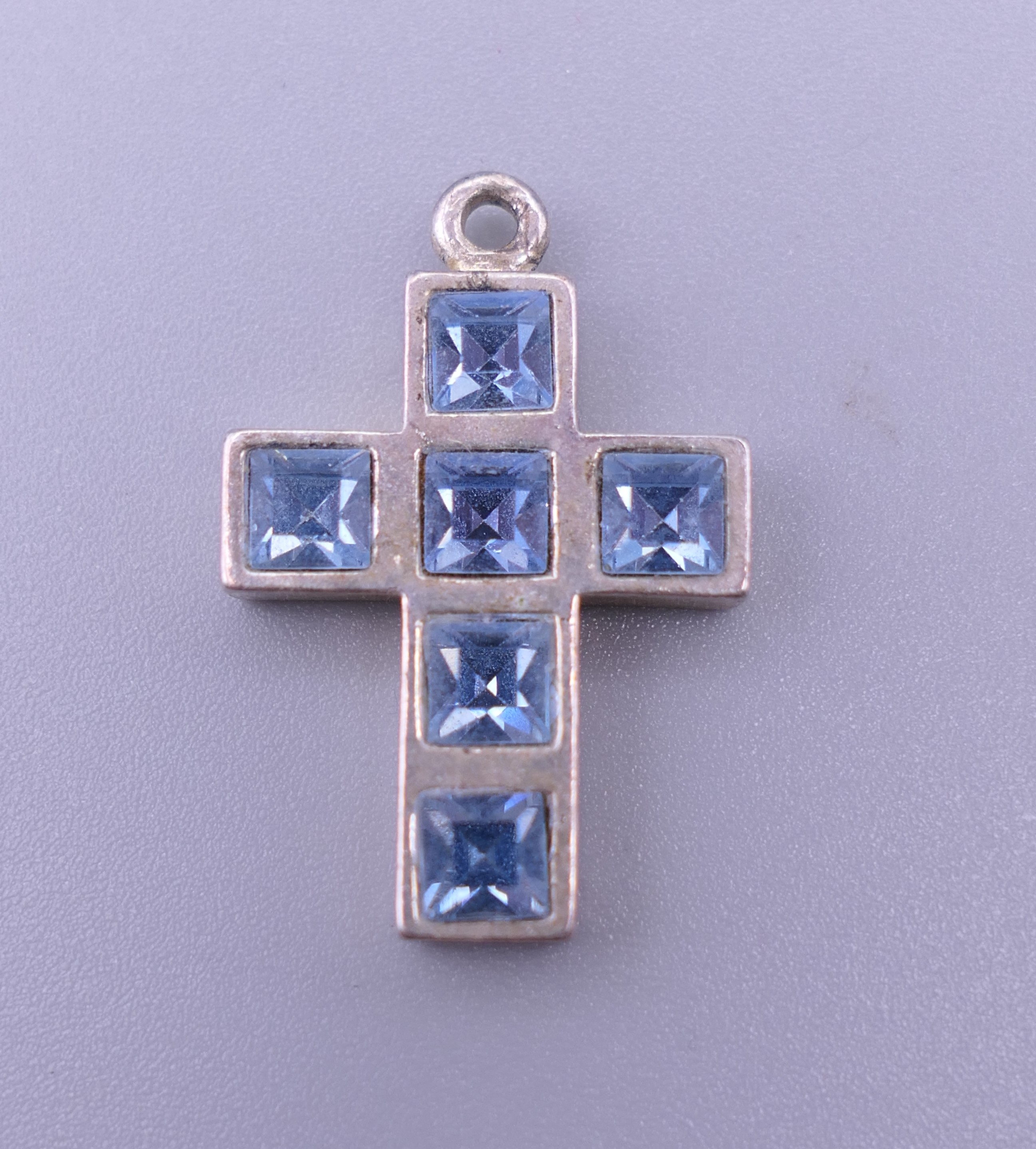 A sterling silver blue stone cross pendant, - Image 6 of 12