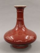 A Chinese sang de boeuf pottery vase. 30 cm high.