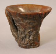 A libation cup. 12 cm high.