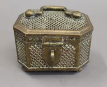 A Chinese brass cricket cage. 13 cm wide.