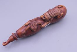 A Japanese travelling brush and brush pot carved with a frog and a tortoise. 14 cm high.