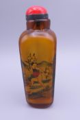 A Chinese smoky coloured interior painted snuff bottle and stopper. 11.5 cm high.