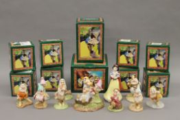 Ten boxed Royal Doulton Snow White and The Seven Dwarfs figurines.