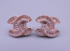 A pair of silver earrings depicting the Chanel logo. Each 1.2 cm high.