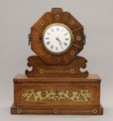 A 19th century brass inlaid rosewood clock.