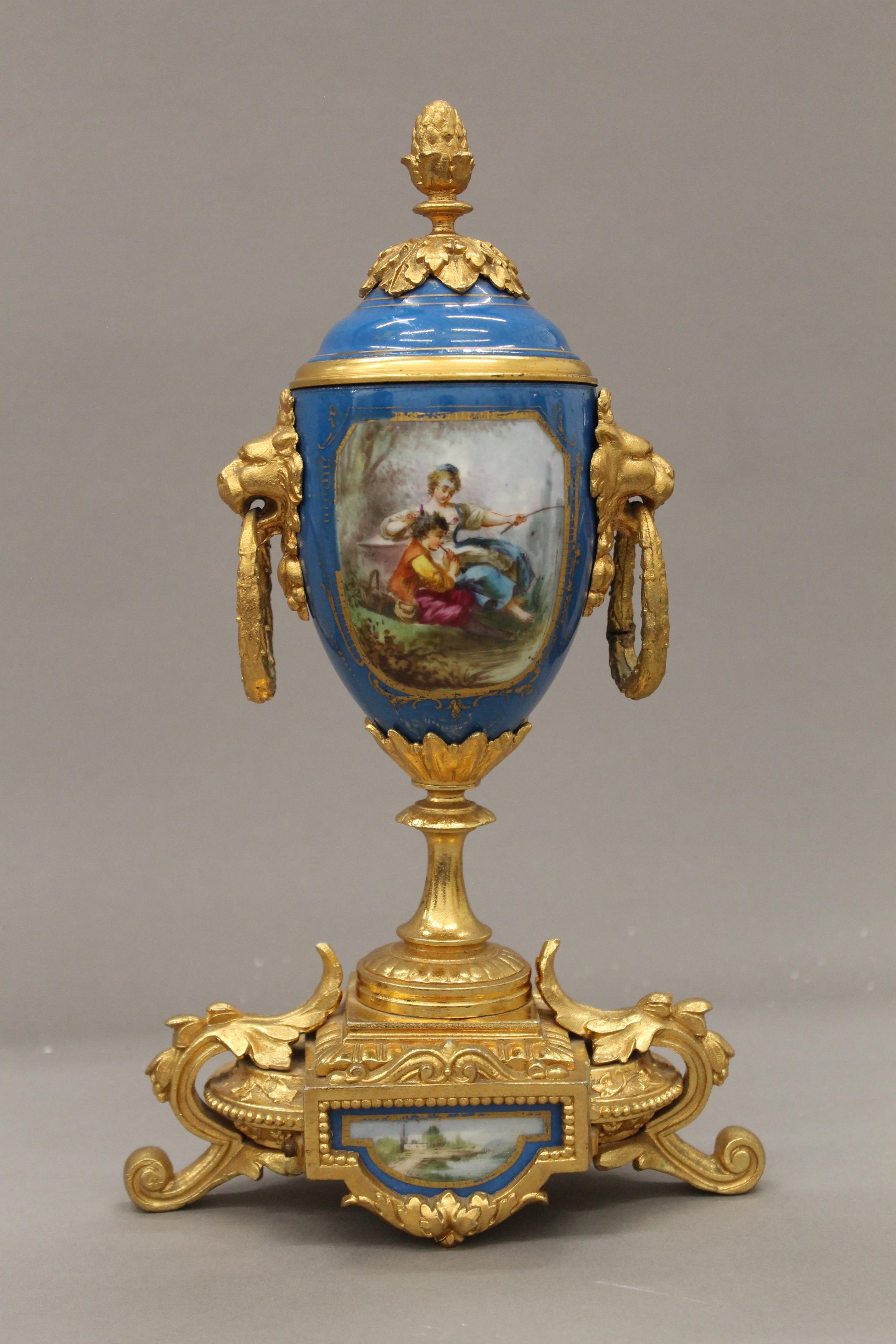 A 19th century gilt and painted porcelain three-piece clock garniture. The clock 37 cm high. - Image 8 of 11