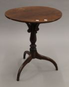 A 19th century mahogany tripod table. 53 cm diameter.