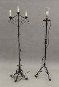 Two wrought iron standard lamps. The largest 161 cm high.